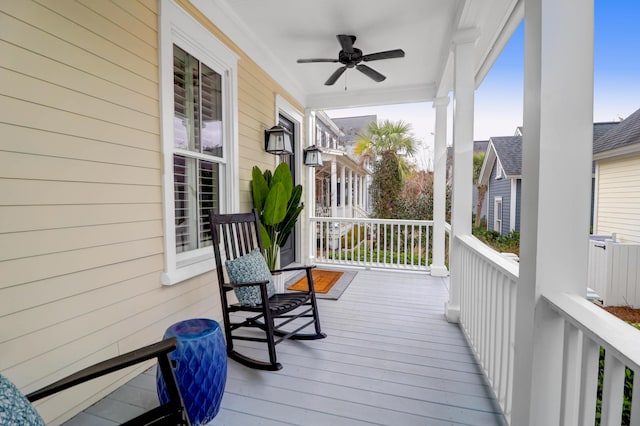 wooden deck with ceiling fan and covered porch