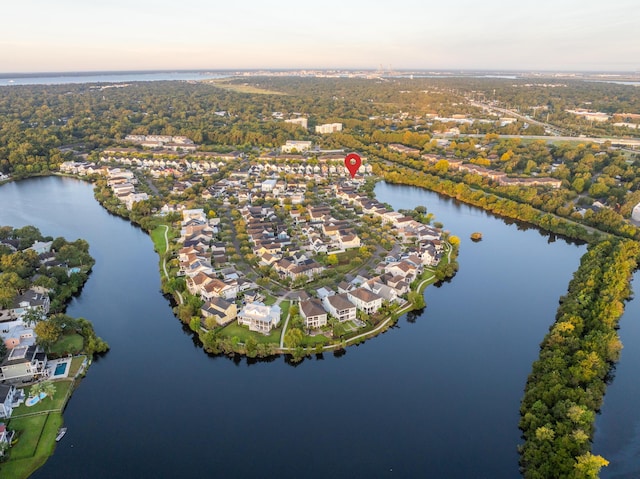 aerial view at dusk with a water view