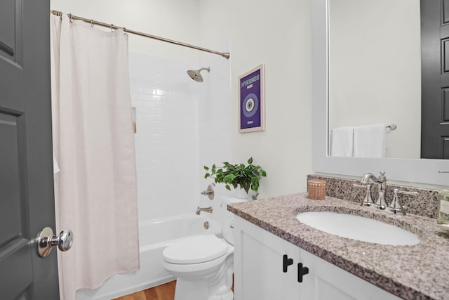 full bathroom with hardwood / wood-style flooring, vanity, toilet, and shower / tub combo with curtain