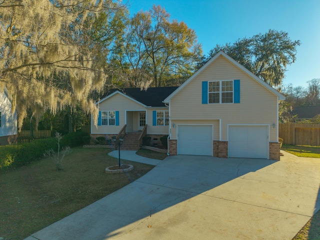 view of front facade with a front yard and a garage