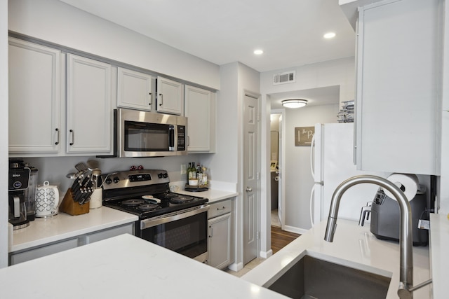 700 Daniel Ellis Dr Unit 10305, Charleston, SC 29412 - kitchen with appliances with stainless steel finishes, light countertops, a sink, recessed lighting, and baseboards