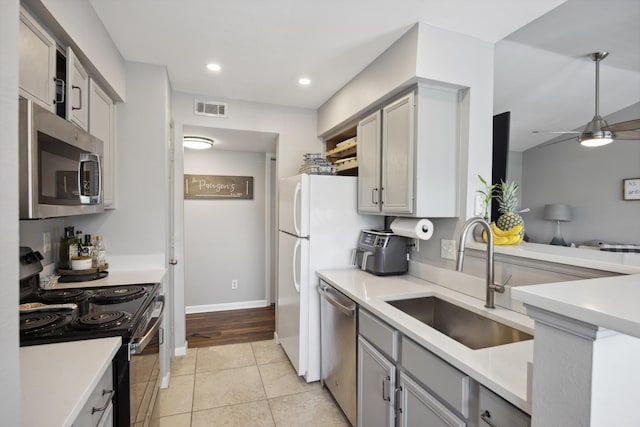 700 Daniel Ellis Dr Unit 10305, Charleston, SC 29412 - kitchen featuring appliances with stainless steel finishes, a sink, gray cabinets, light tile patterned floors, and light countertops