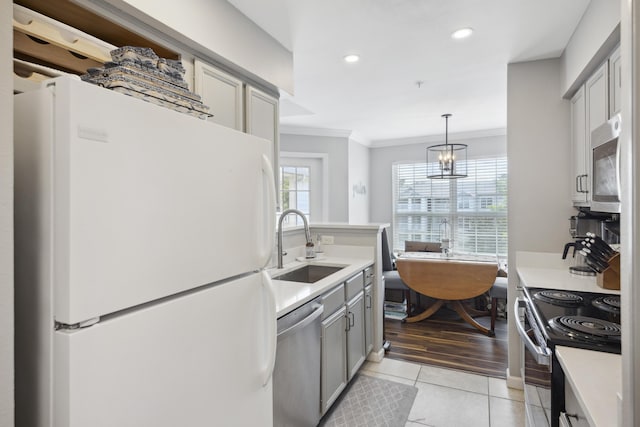 700 Daniel Ellis Dr Unit 10305, Charleston, SC 29412 - kitchen featuring stainless steel appliances, a sink, ornamental molding, light tile patterned flooring, and light countertops