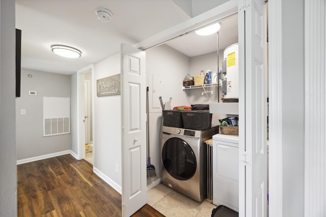 700 Daniel Ellis Dr Unit 10305, Charleston, SC 29412 - laundry room featuring washing machine and clothes dryer, water heater, wood finished floors, and baseboards