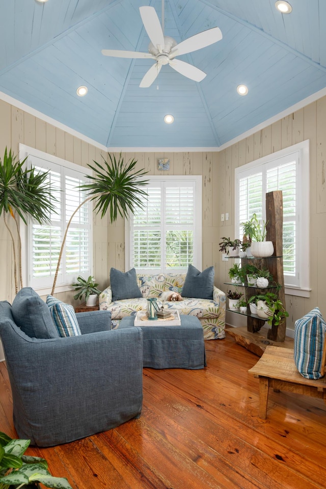living area with wood-type flooring, lofted ceiling, a ceiling fan, recessed lighting, and wood ceiling
