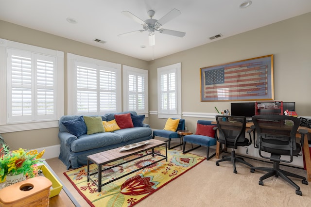 carpeted office featuring healthy amount of natural light and ceiling fan