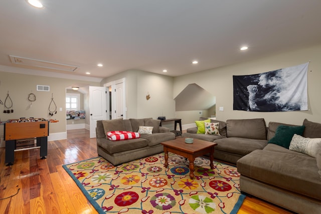 living area featuring attic access, wood finished floors, recessed lighting, and baseboards