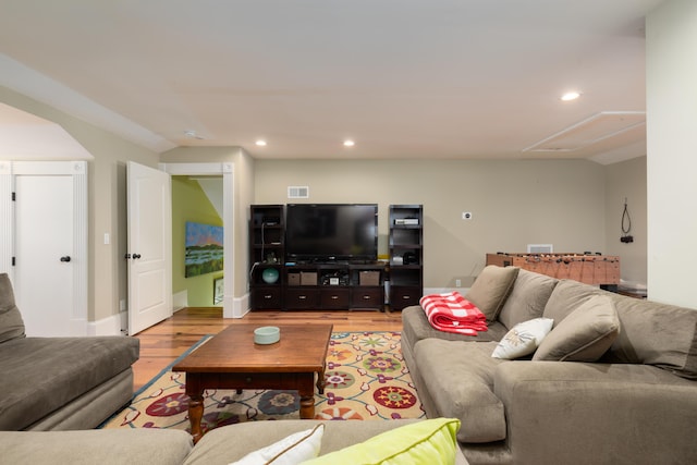 living area with attic access, light wood finished floors, recessed lighting, and baseboards