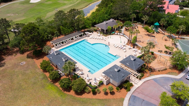 aerial view of a pool area, a golf club, and a large body of water