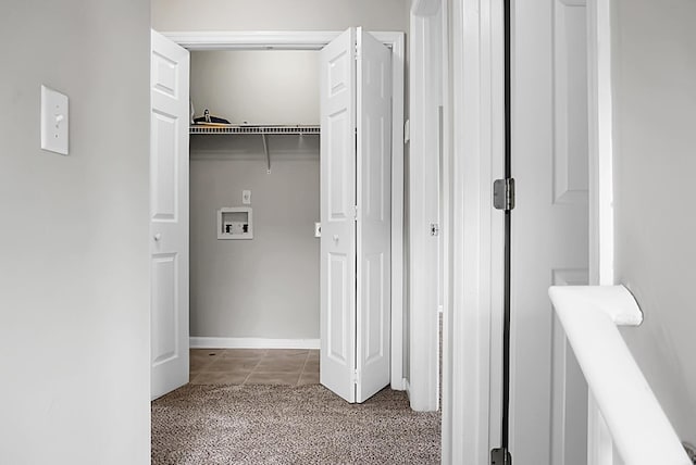 laundry area with tile patterned flooring, washer hookup, laundry area, and carpet floors