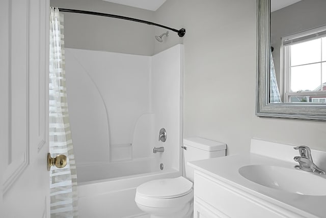 bathroom featuring shower / tub combo with curtain, toilet, and vanity