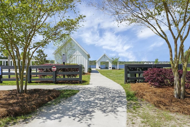 view of community featuring fence