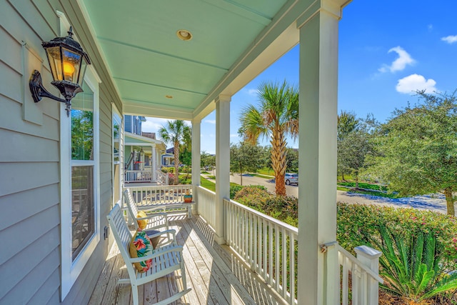 wooden terrace with a porch