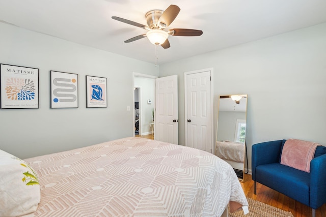 bedroom with ceiling fan, a closet, and wood finished floors