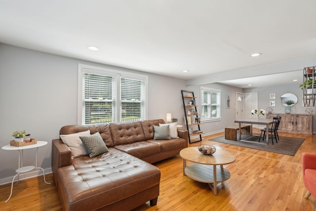 living room featuring light wood-style floors, recessed lighting, and baseboards