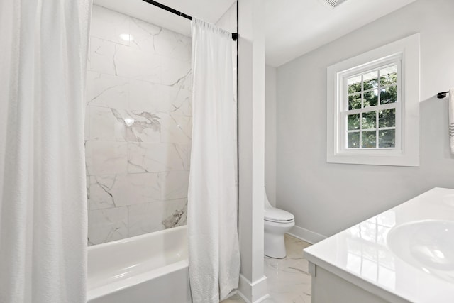 full bathroom with baseboards, a sink, shower / bath combo with shower curtain, toilet, and marble finish floor