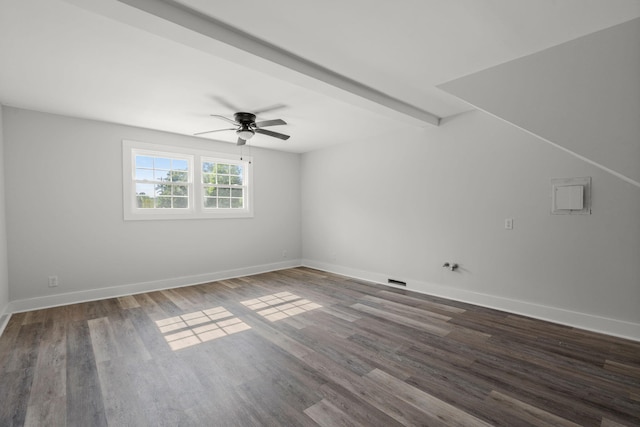 spare room featuring baseboards, a ceiling fan, and wood finished floors