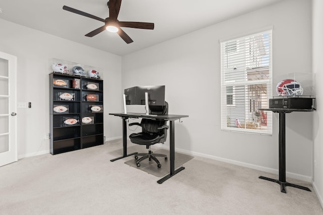 office space with light carpet and ceiling fan