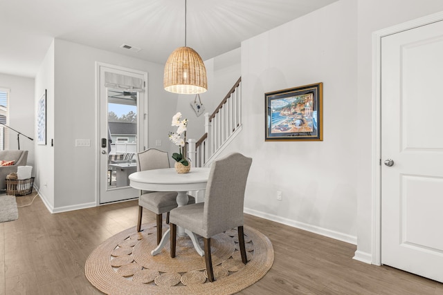 dining area featuring dark wood-type flooring