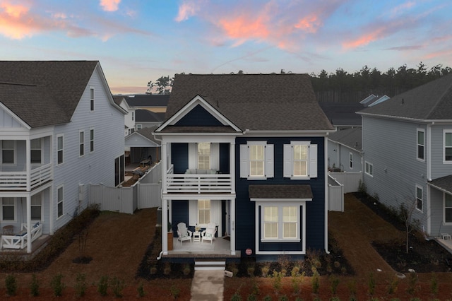 view of front of house with a balcony and a porch