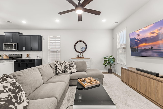 living room featuring ceiling fan