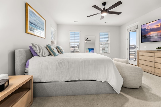 bedroom with carpet flooring, ceiling fan, and access to exterior