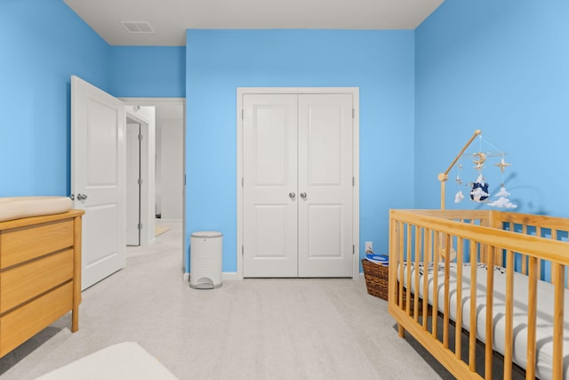 carpeted bedroom featuring a closet