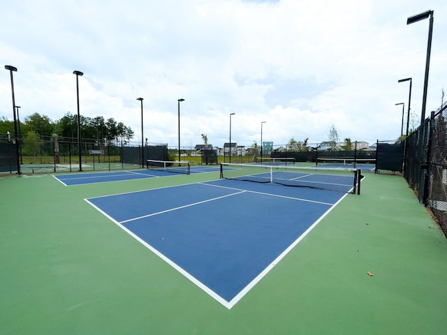 view of tennis court with basketball court