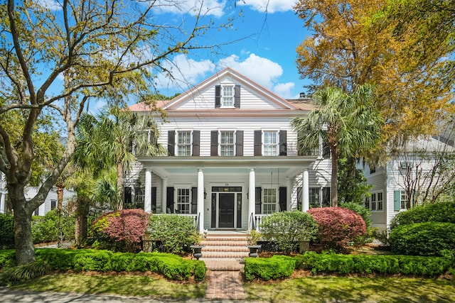 greek revival house with covered porch