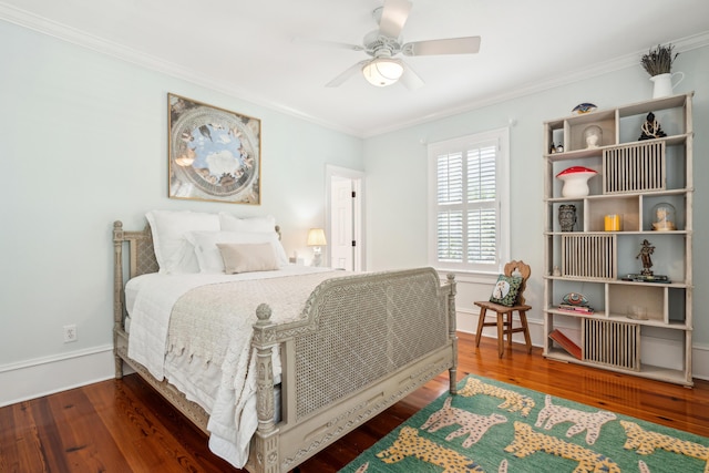 bedroom with baseboards, a ceiling fan, wood finished floors, and crown molding