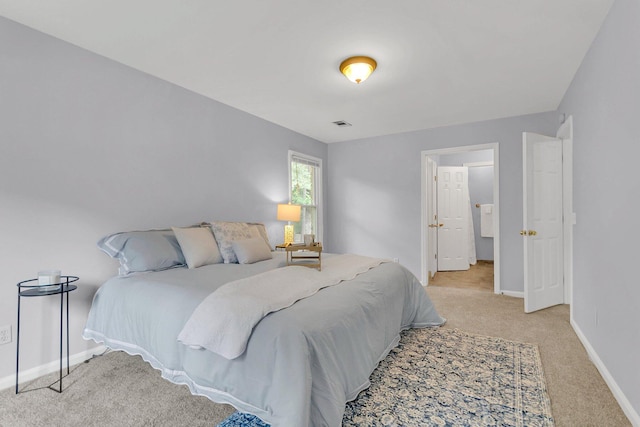 bedroom with light carpet