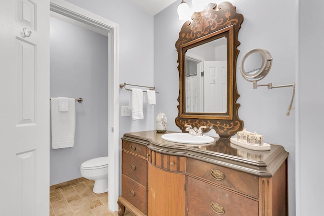 bathroom with vanity and toilet