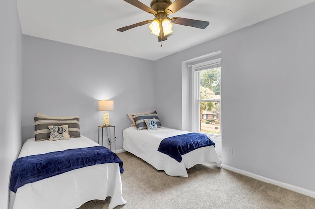 bedroom with ceiling fan and carpet flooring