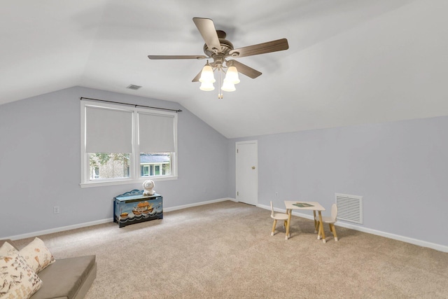 living area with light carpet, lofted ceiling, and ceiling fan