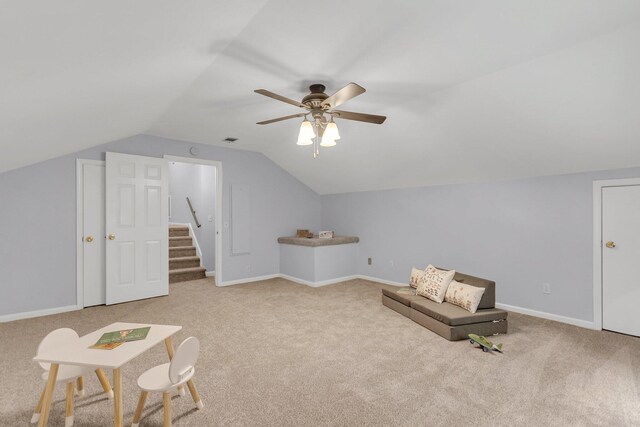 sitting room featuring lofted ceiling, ceiling fan, and carpet