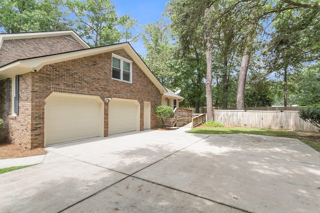 view of side of home featuring a garage