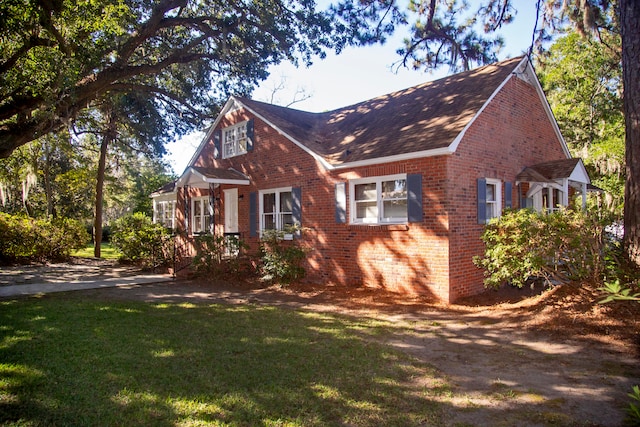 view of home's exterior with a lawn