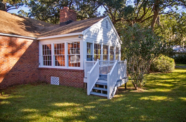 view of property exterior featuring a yard