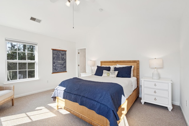 bedroom with visible vents, carpet flooring, baseboards, and ceiling fan