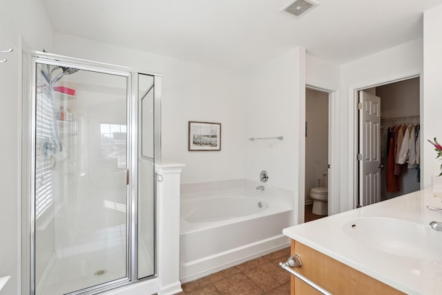 full bath with visible vents, toilet, a garden tub, a stall shower, and tile patterned floors