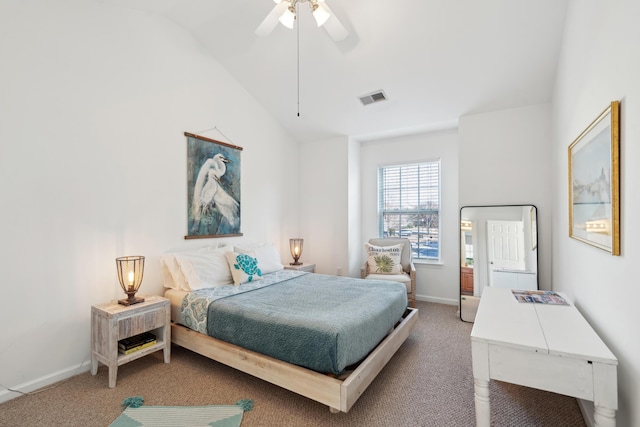 carpeted bedroom featuring a ceiling fan, vaulted ceiling, baseboards, and visible vents