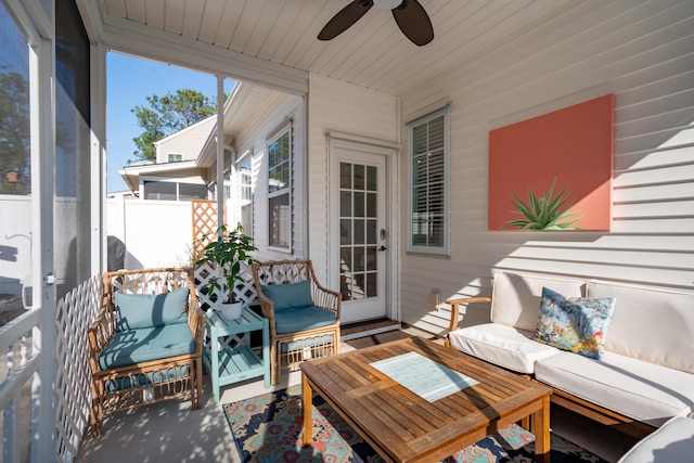 sunroom featuring wooden ceiling and a ceiling fan