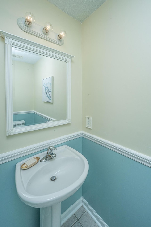 1401 Elm Hall Cir, Summerville, SC 29483 - bathroom featuring tile patterned floors, a sink, and a textured ceiling
