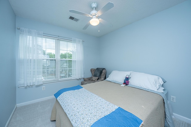 1401 Elm Hall Cir, Summerville, SC 29483 - bedroom featuring baseboards, carpet flooring, a ceiling fan, and a textured ceiling