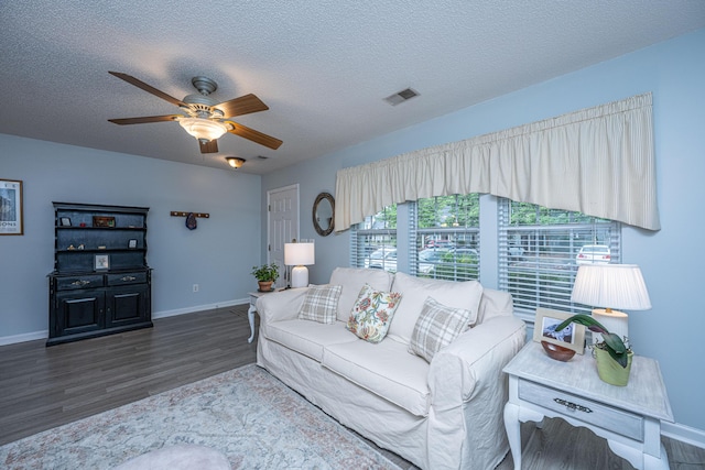 1401 Elm Hall Cir, Summerville, SC 29483 - living room with wood finished floors, ceiling fan, baseboards, and a textured ceiling