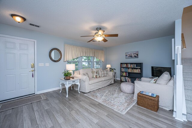 1401 Elm Hall Cir, Summerville, SC 29483 - living room with a ceiling fan, a textured ceiling, wood finished floors, and baseboards