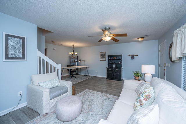 1401 Elm Hall Cir, Summerville, SC 29483 - living room featuring wood finished floors, stairway, a chandelier, ceiling fan, and a textured ceiling