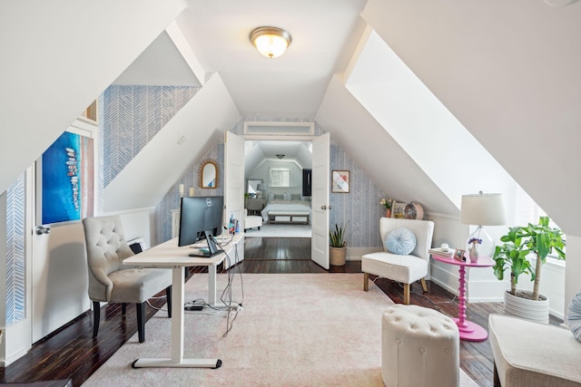 office area with wood-type flooring and vaulted ceiling