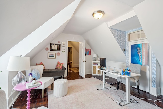 home office featuring hardwood / wood-style flooring and vaulted ceiling