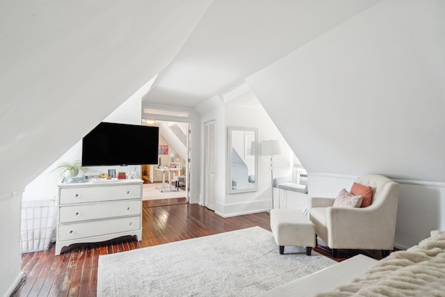 bedroom with dark hardwood / wood-style flooring and vaulted ceiling